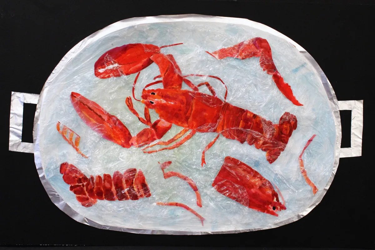 Lobster sculpture made from foil and plastic inside a painted boiling pot